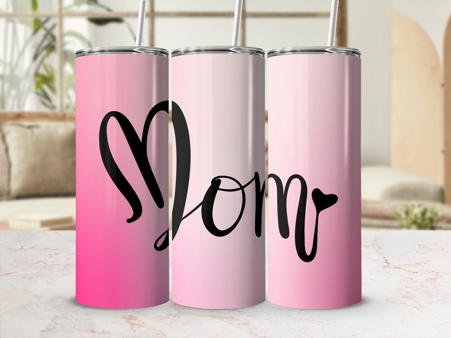 Pink gradient tumbler with black "Mom" text.