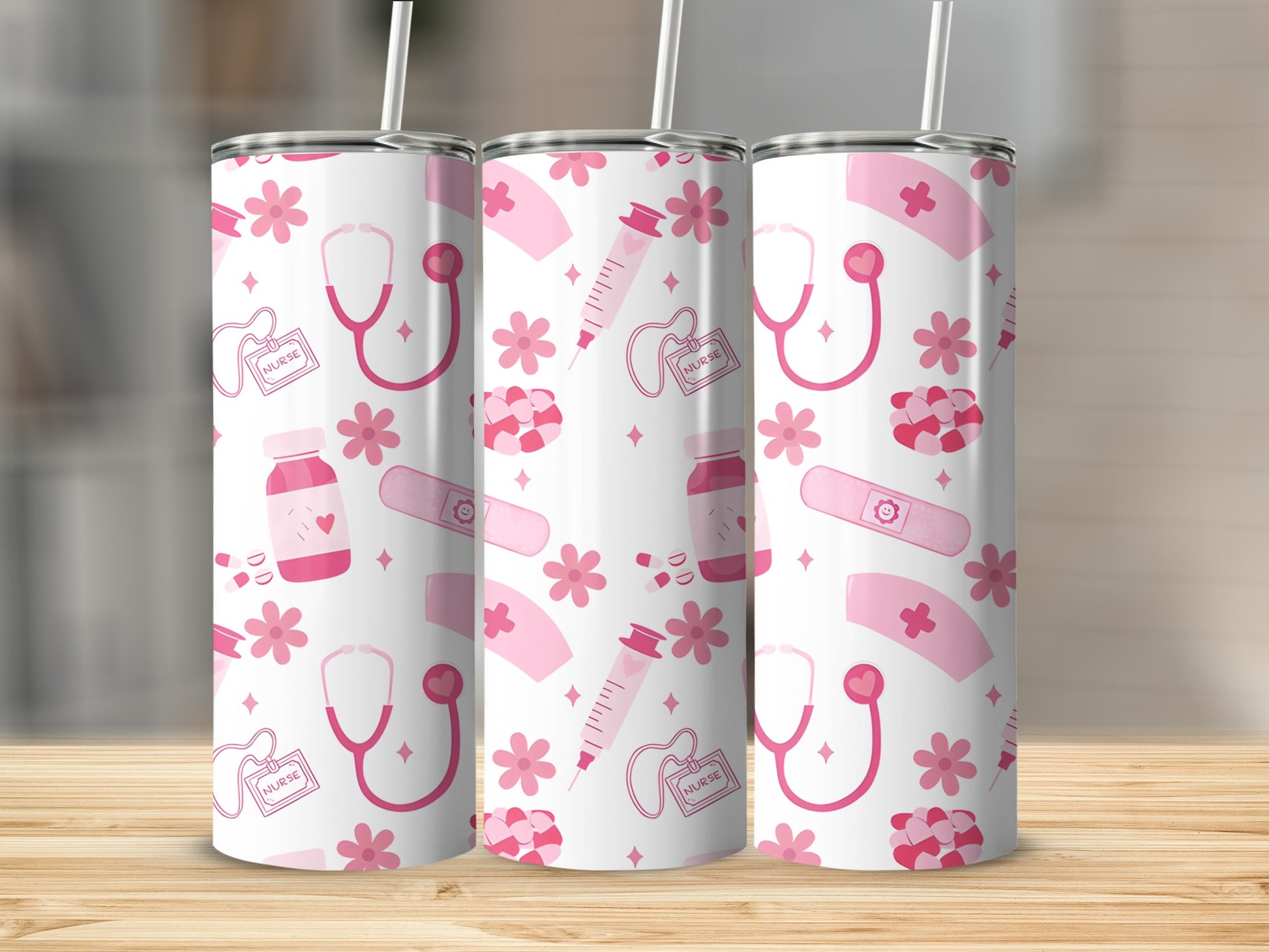Three pink nurse-themed tumblers with stethoscopes, pills, and flowers.