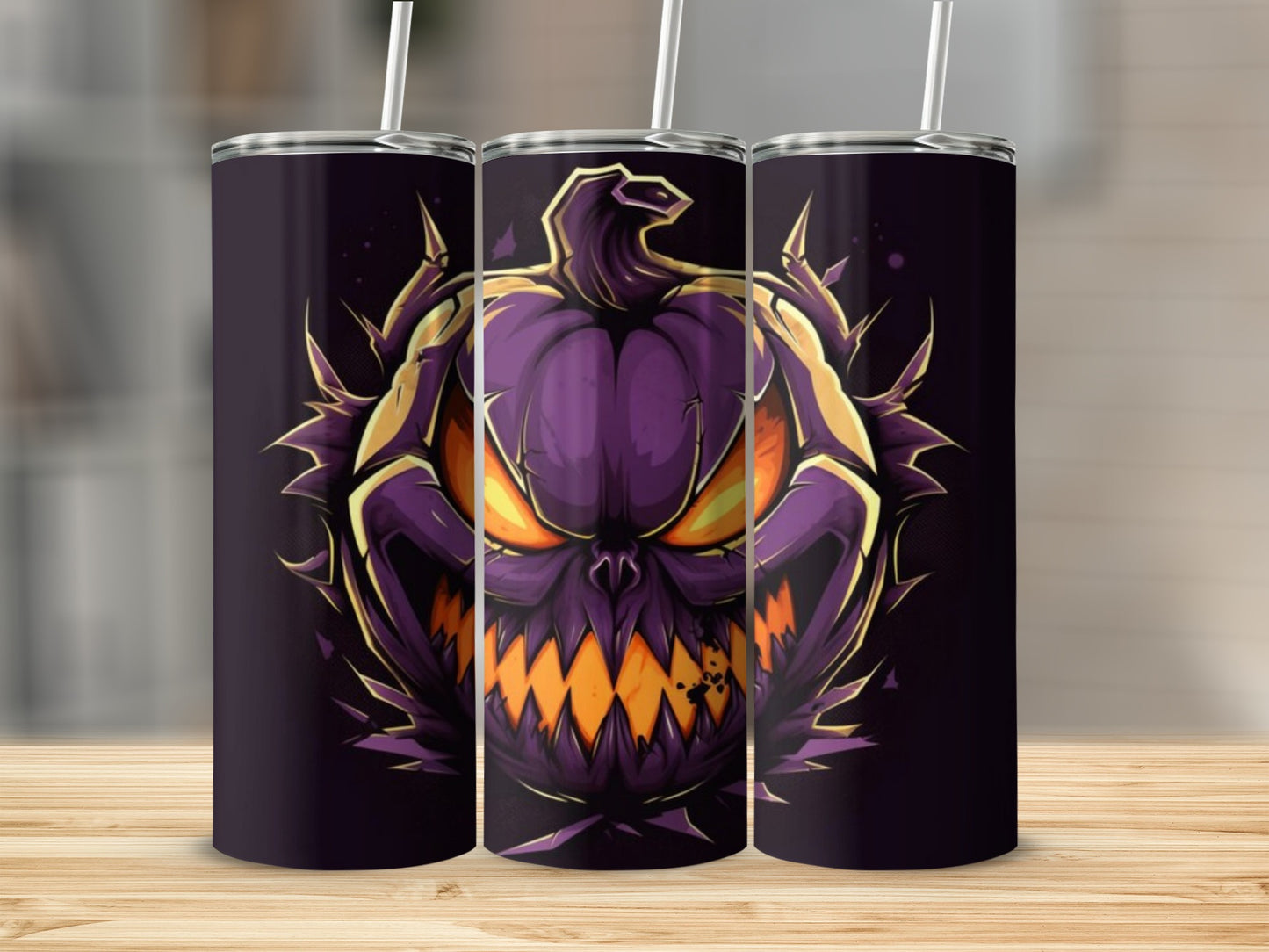 Three tumblers featuring a fierce purple monster pumpkin with glowing orange eyes.