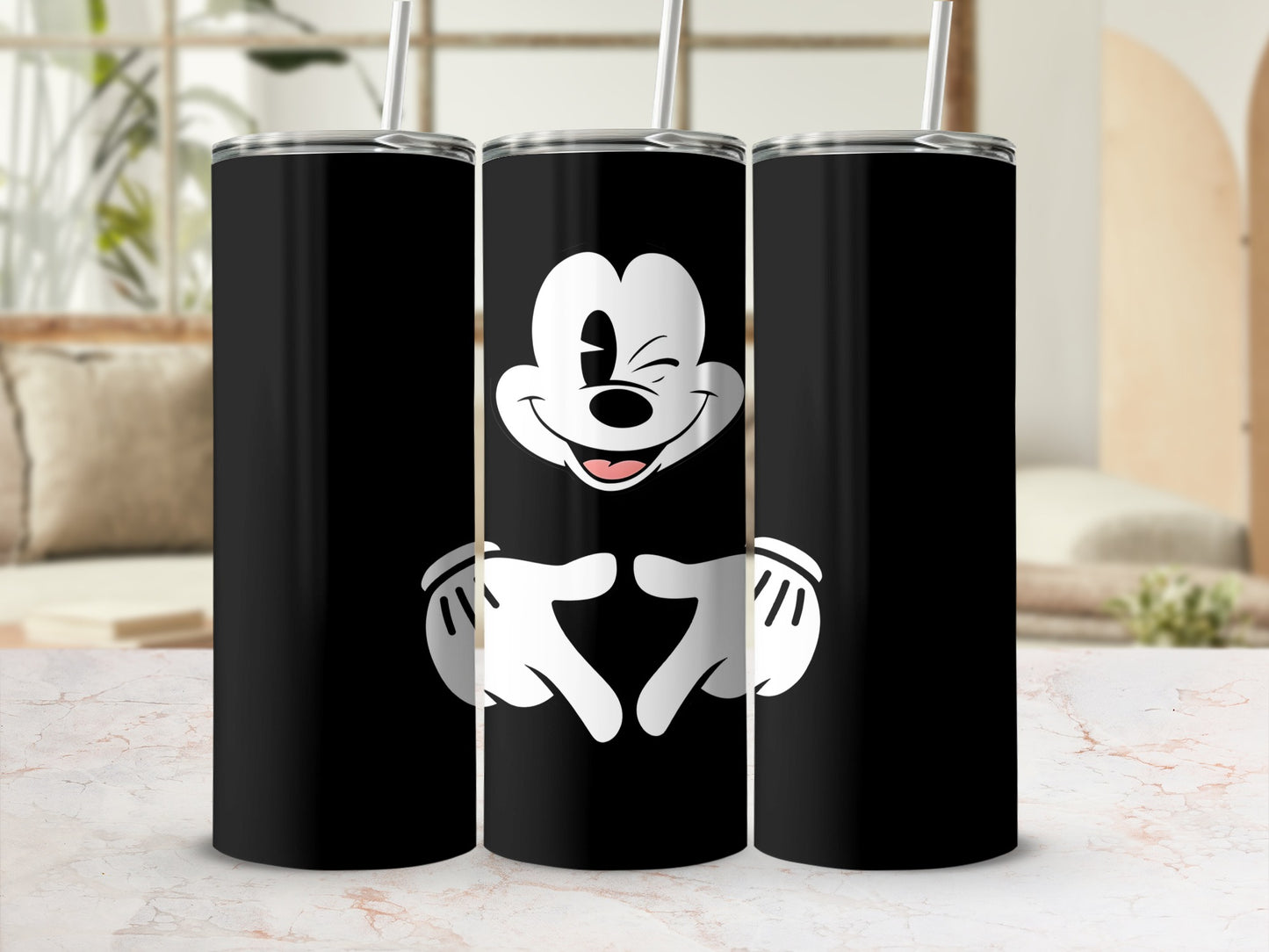 Black tumbler with Mickey Mouse winking, hands forming a heart shape.