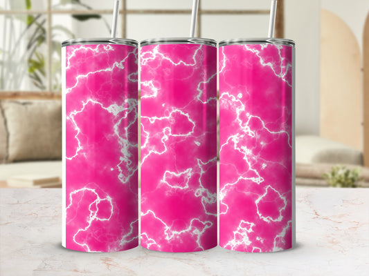 Three pink marble patterned tumblers with straws on a counter.