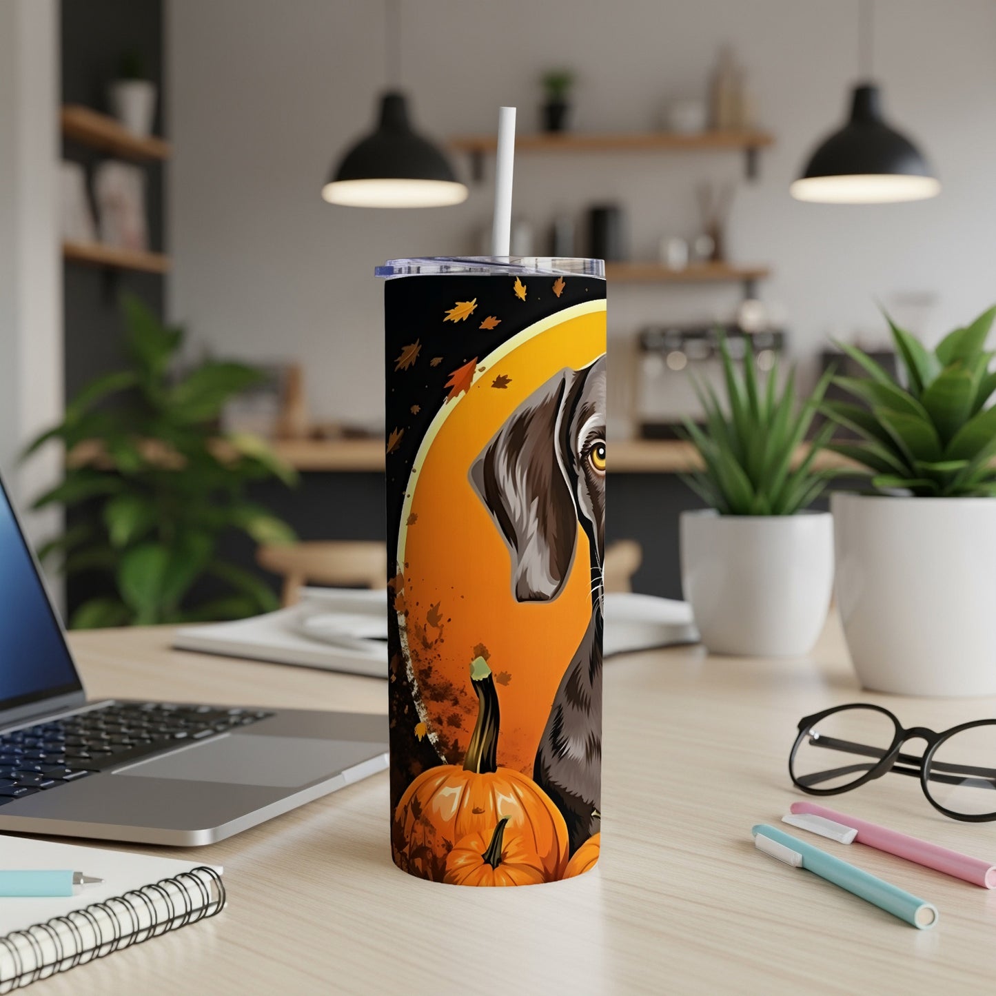 Tumbler with brown dog and pumpkins on an orange background with fall leaves.