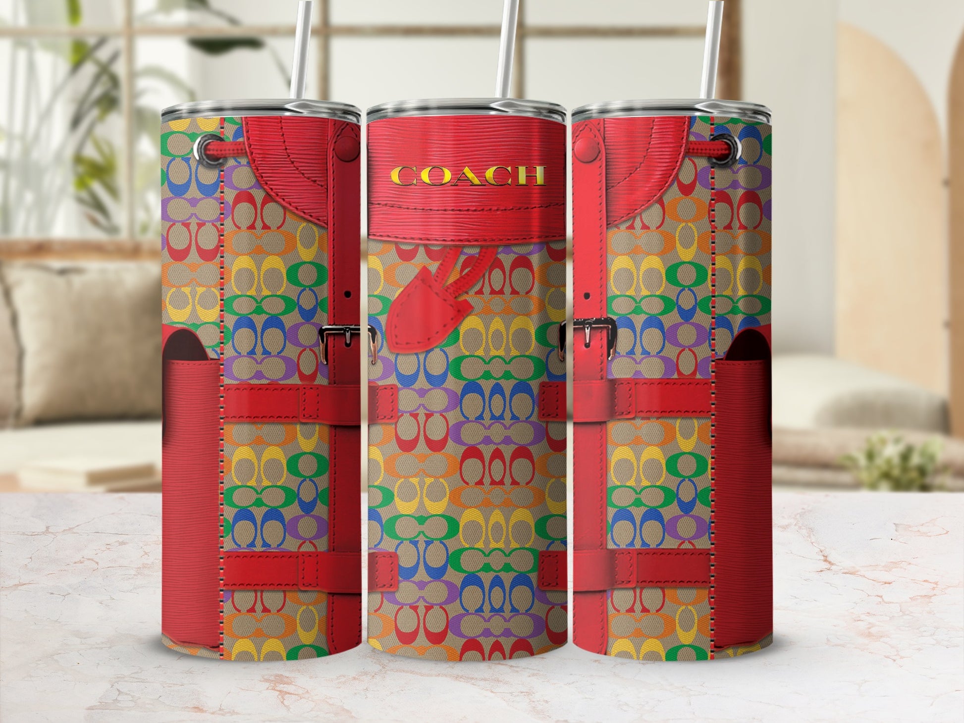 Three tumblers with a rainbow Coach logo pattern and red leather accents.