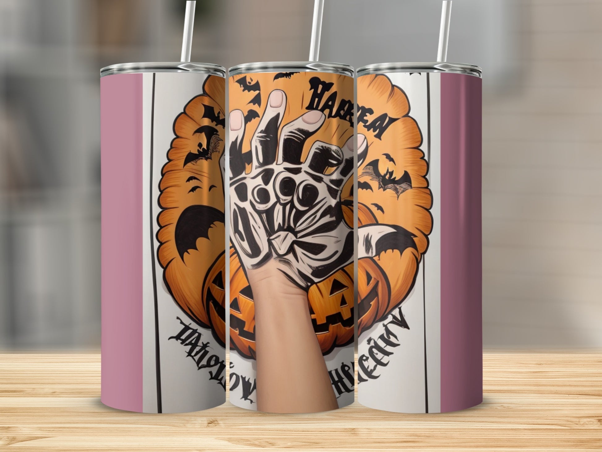 Halloween tumbler with pumpkins, bats, and a clawed glove graphic.