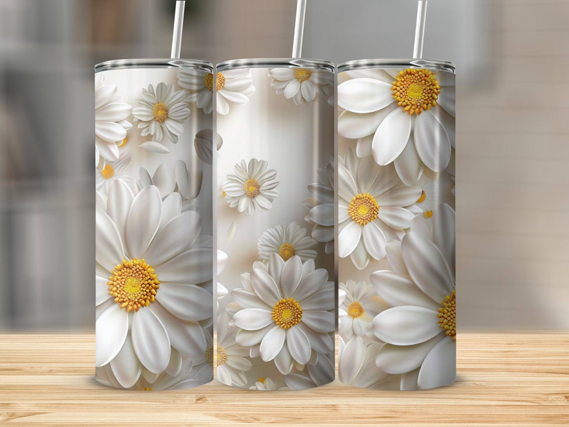 Three white daisy tumblers with yellow centers arranged on a wooden surface.