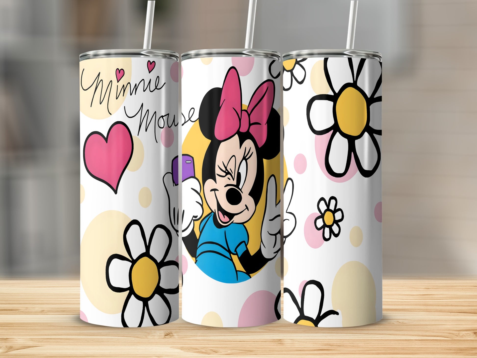 Minnie Mouse tumbler with pink heart and yellow flowers.
