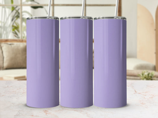 Three plain lavender tumblers with straws stand on a marble countertop.