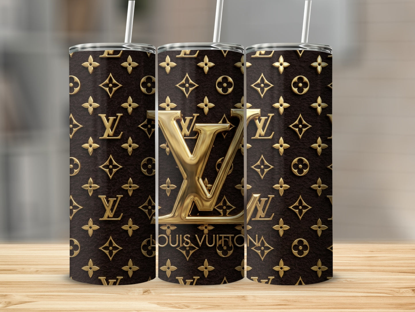 Three tumblers with brown leather texture and gold Louis Vuitton monogram pattern.