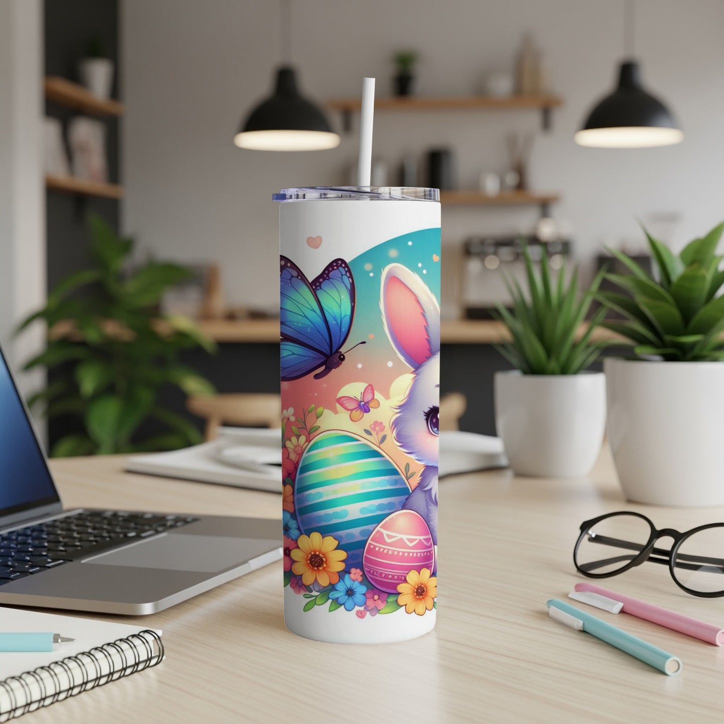 Easter bunny, eggs, and butterfly on a tumbler with a straw.