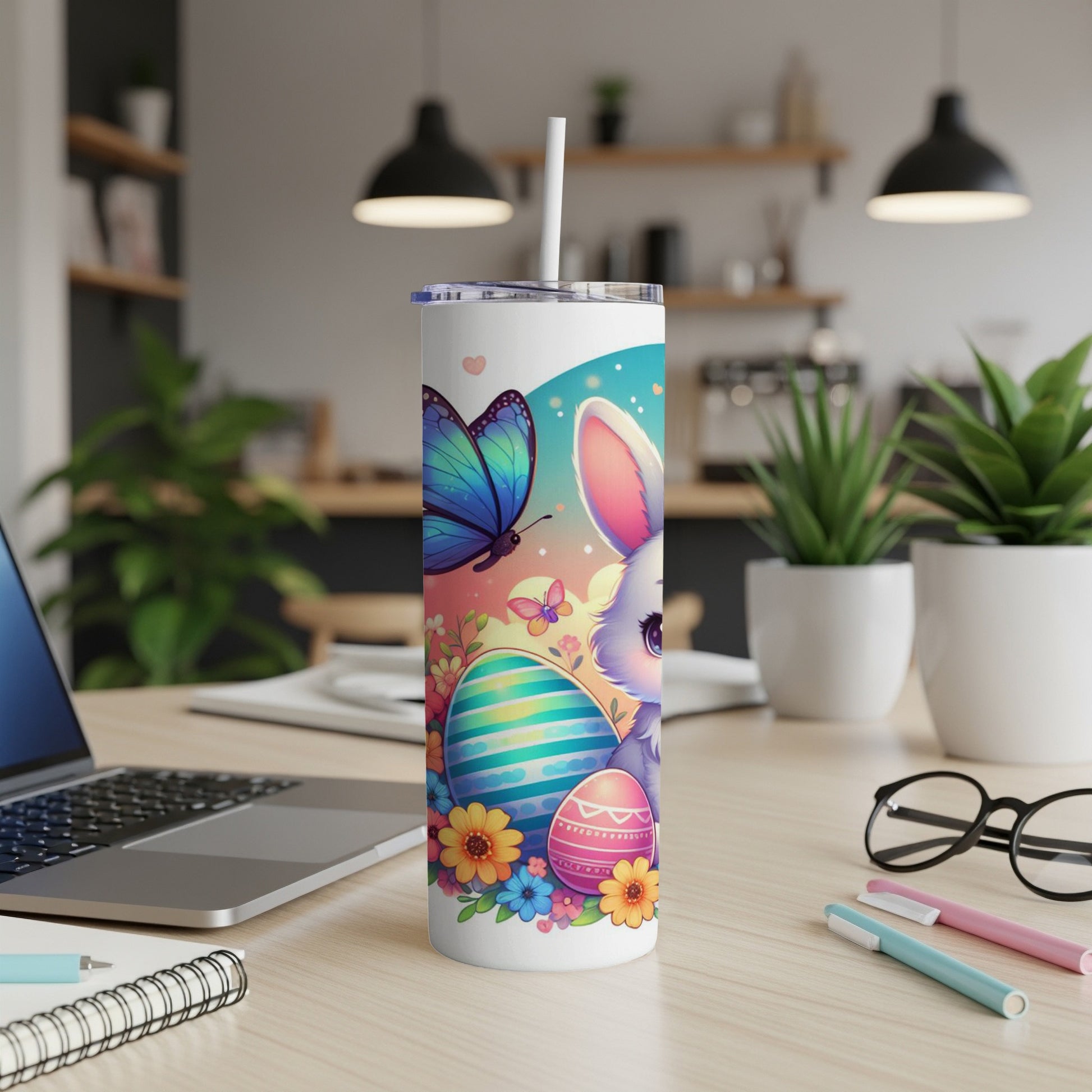 Easter bunny, eggs, and butterfly on a tumbler with a straw.