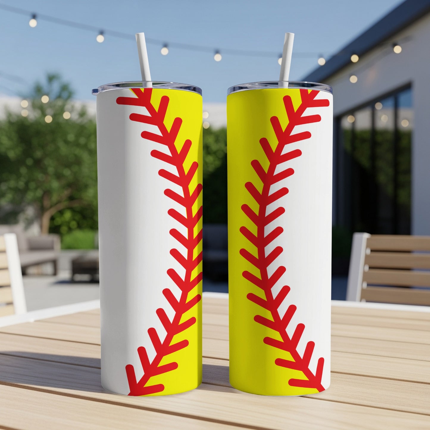 Two tall tumblers with a red softball stitch design on a white background.