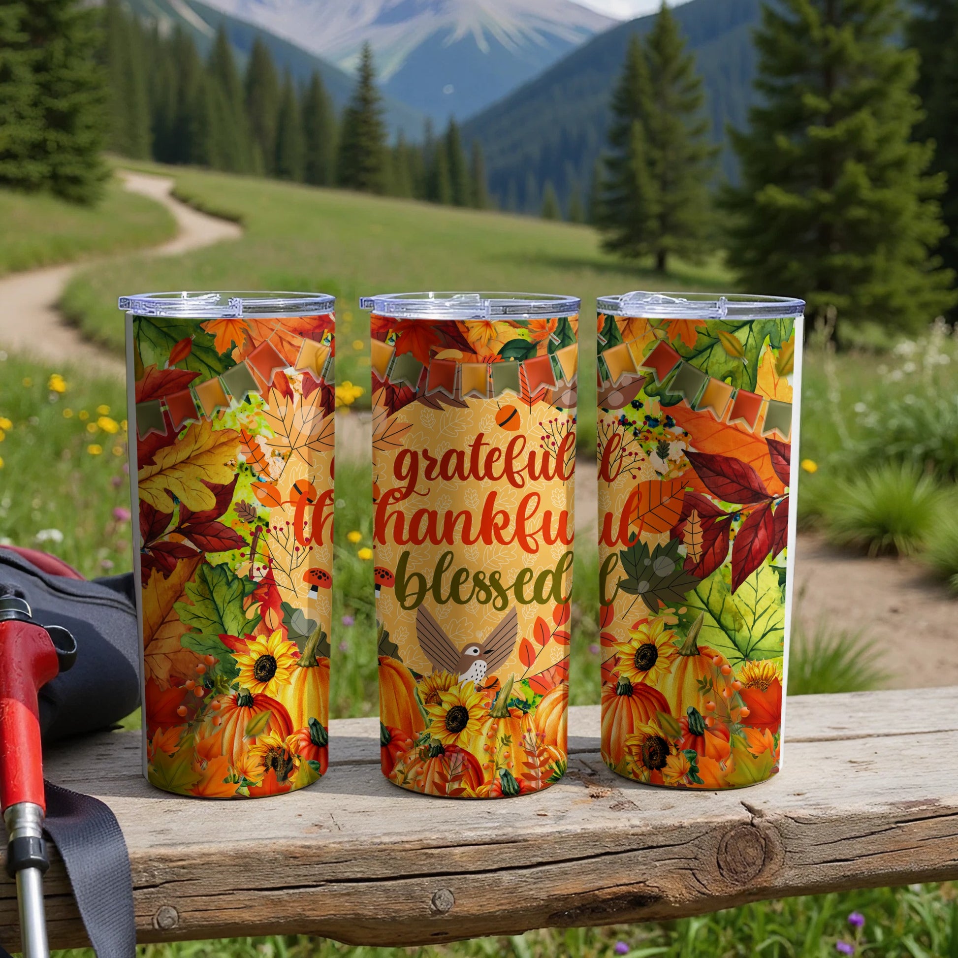 Three fall-themed tumblers with "grateful thankful blessed" text on the middle one.