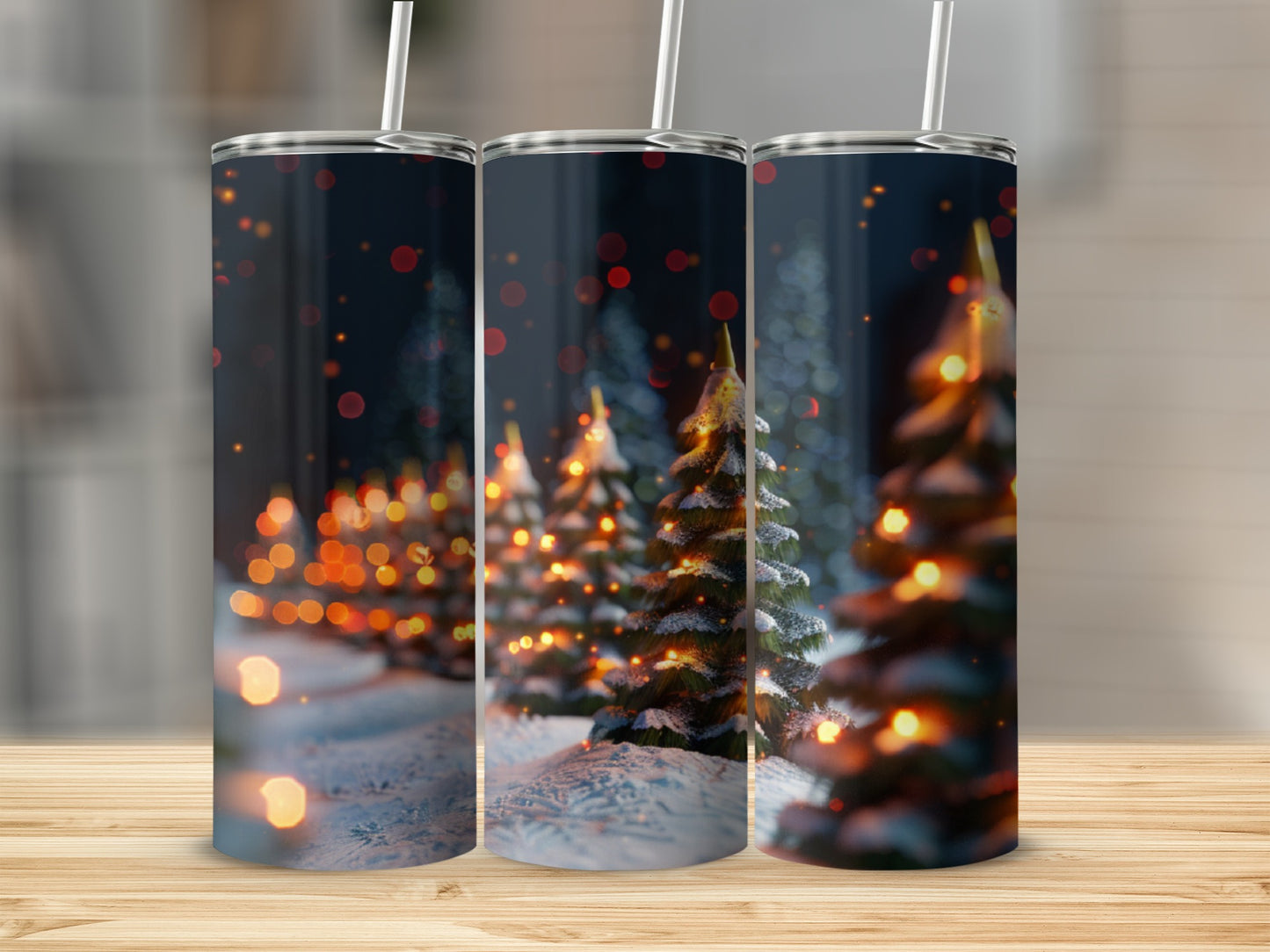 Three tumblers with a snowy Christmas tree forest scene and bokeh lights.