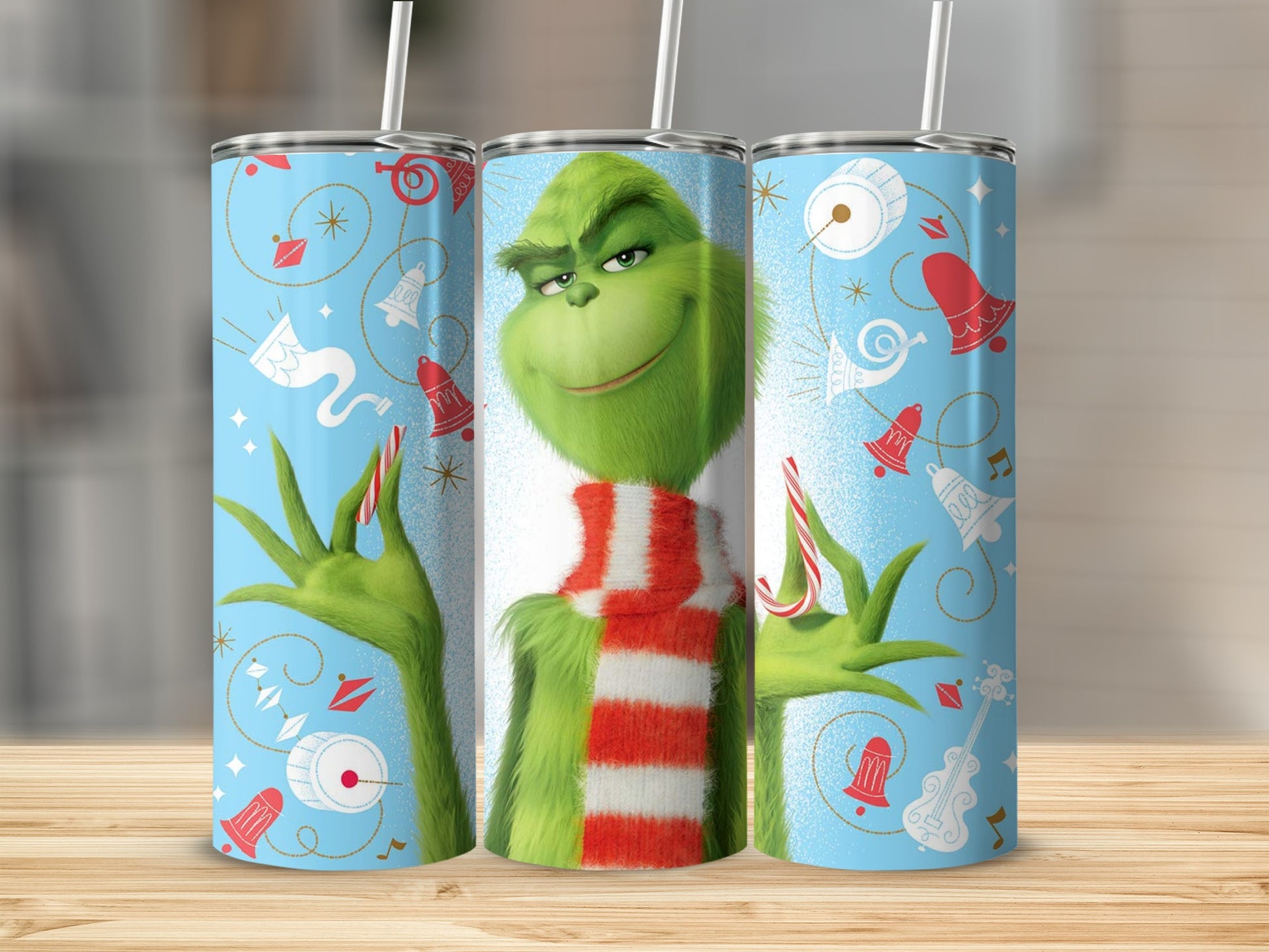 Grinch with candy cane and festive holiday pattern on tumbler.