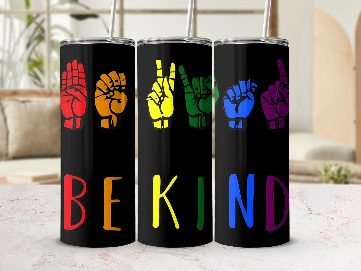 Black tumbler with "BE KIND" in rainbow sign language letters.