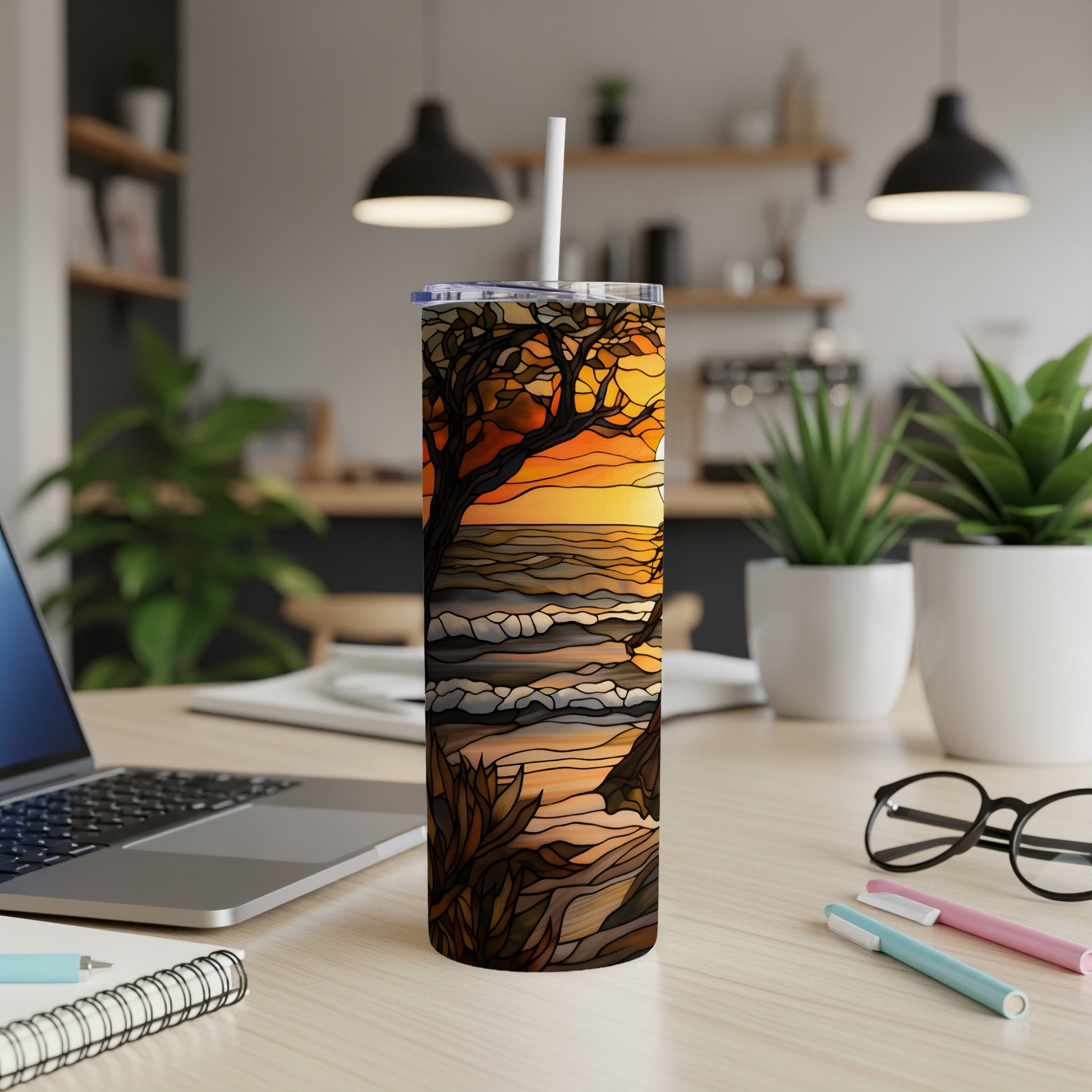 Stained glass sunset beach scene on a white insulated tumbler.