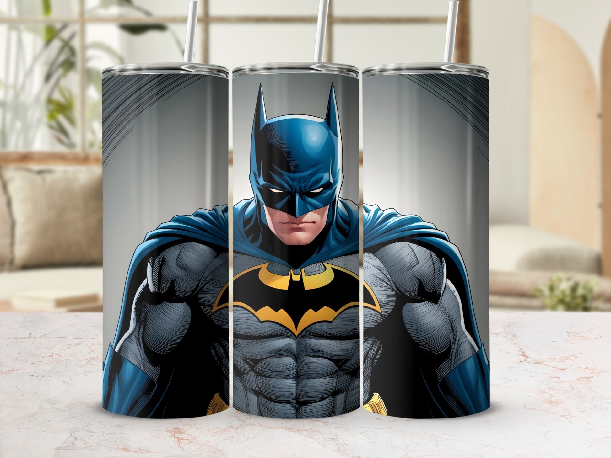 Batman illustration on a stainless steel tumbler with two straws.