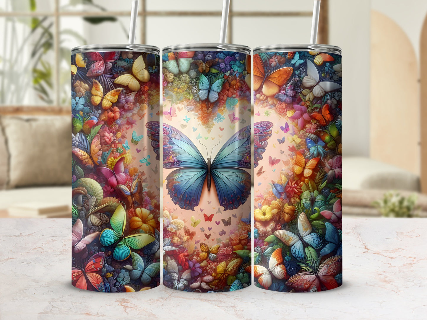 Three tumblers adorned with colorful butterfly and floral patterns.