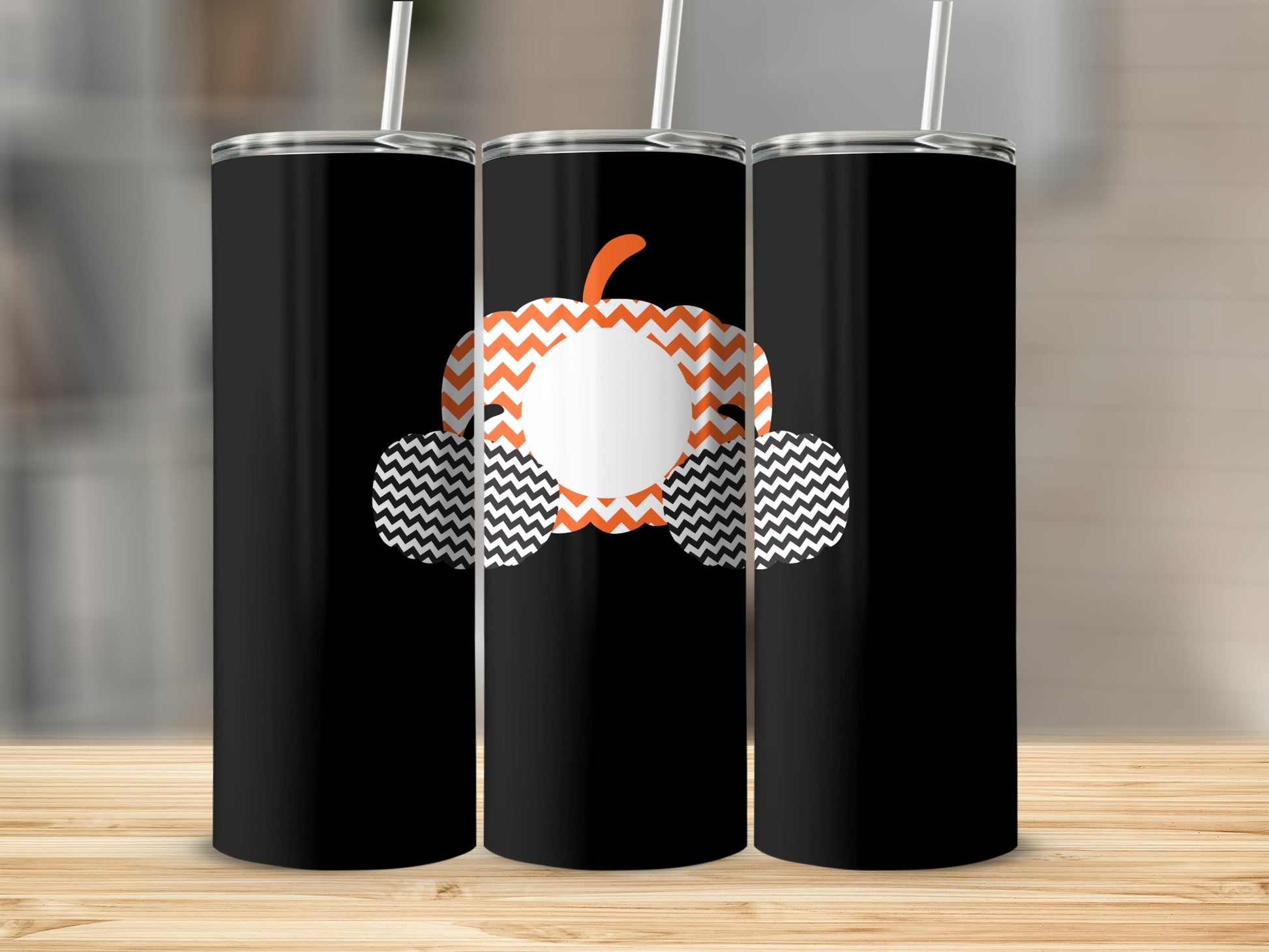 Three black tumblers with chevron pumpkin and tire graphics.