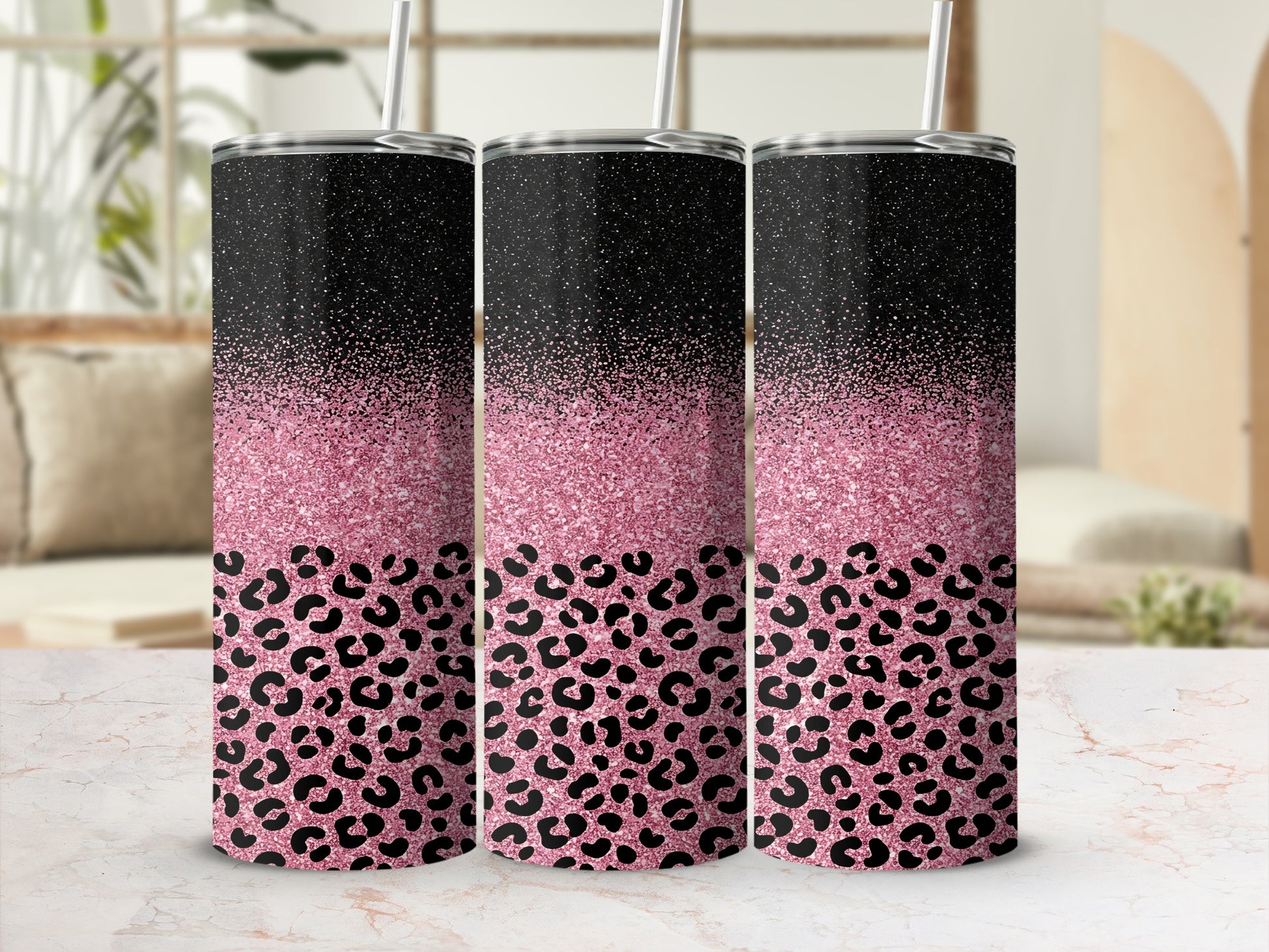 Three tumblers with black leopard print and pink glitter designs.