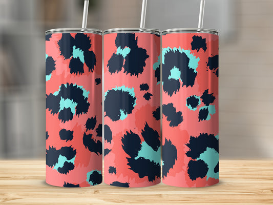 Three tall tumblers with a coral background and abstract navy and teal leopard print pattern.