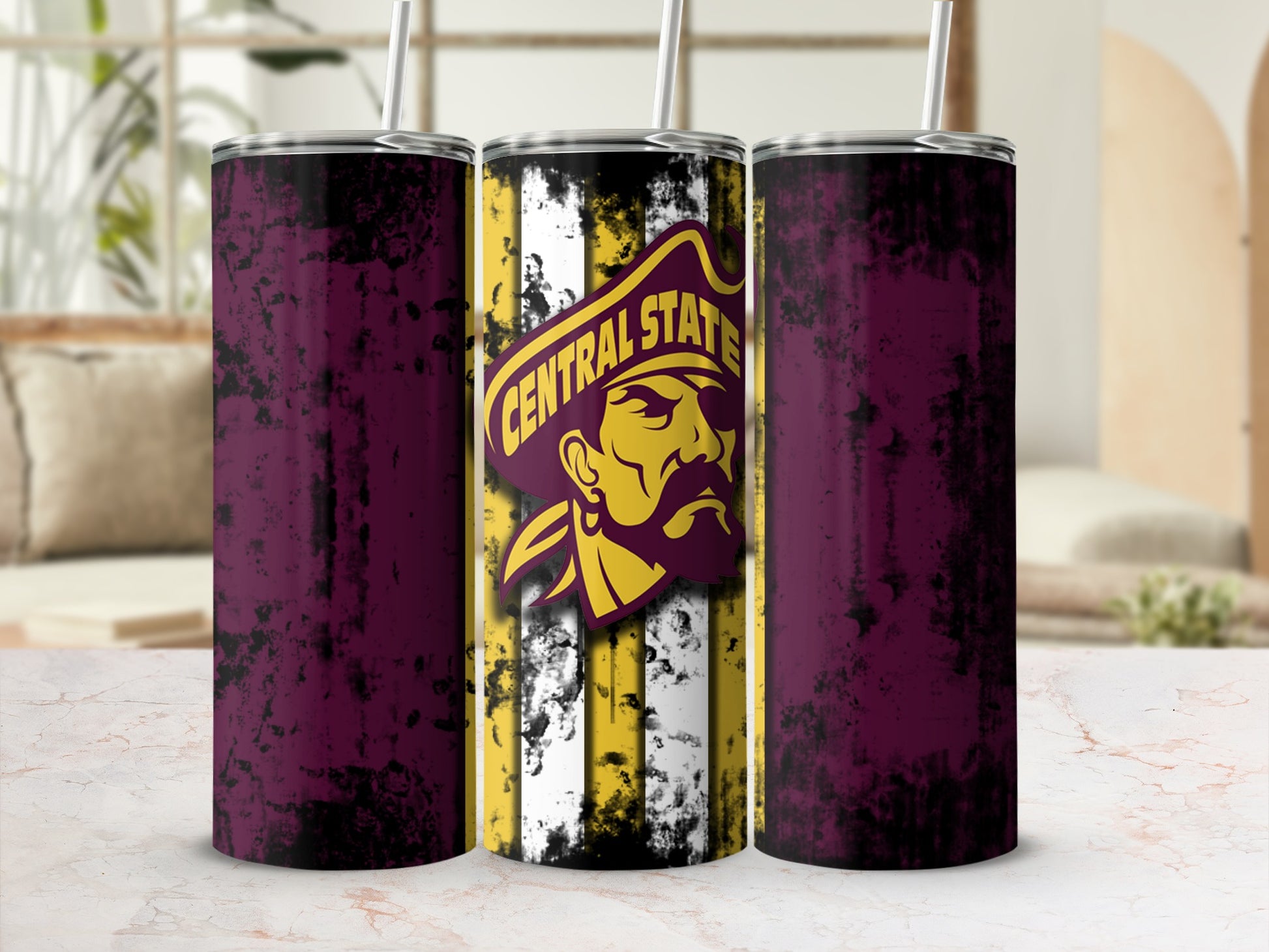 Three tumblers with distressed maroon sides and a central tumbler with pirate logo and Central State text.