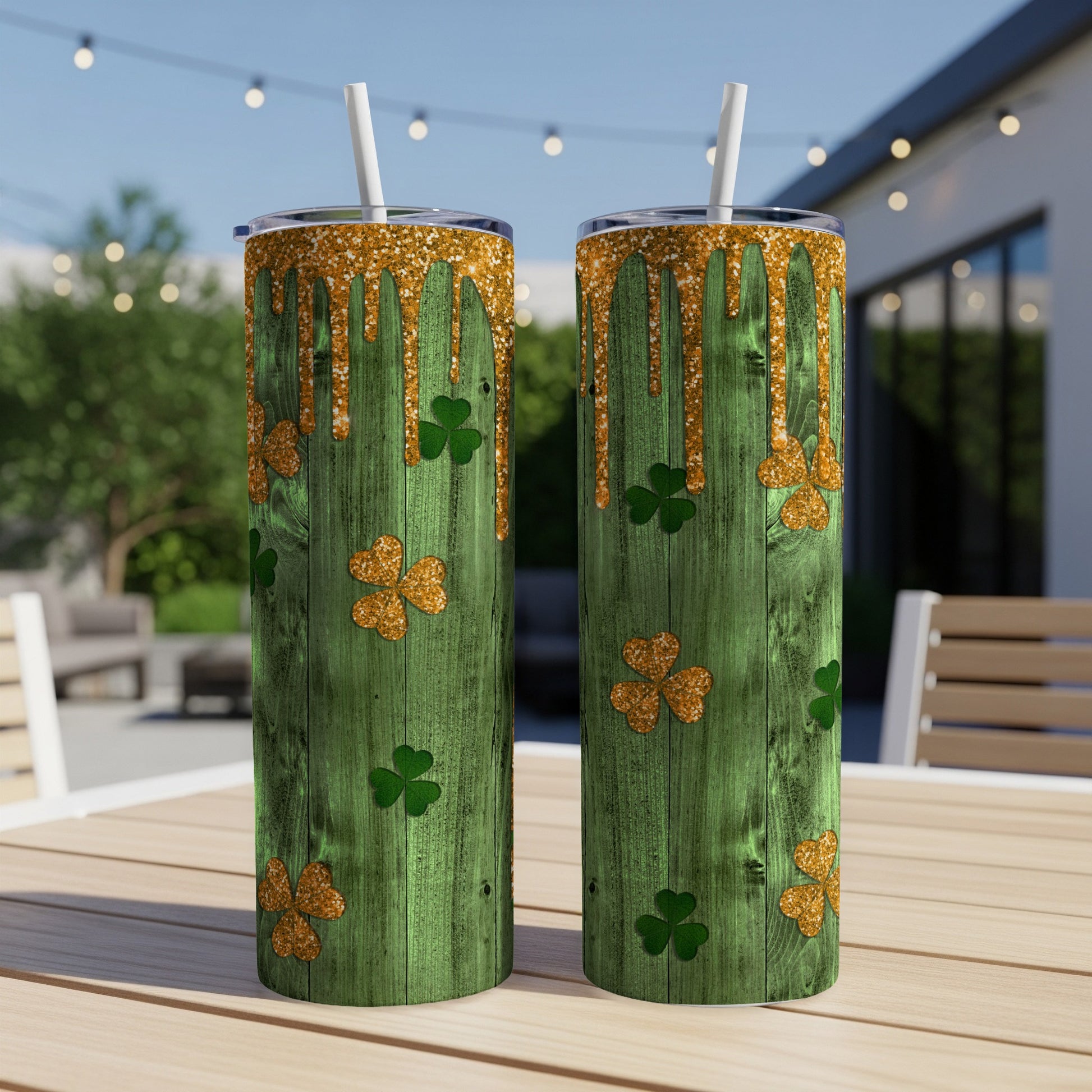 Two green wooden tumblers with shamrocks and gold glitter drips.