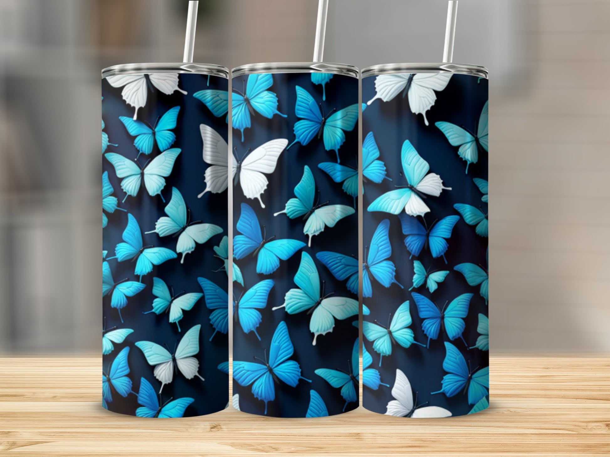 Three tumblers with a pattern of blue and white butterflies.