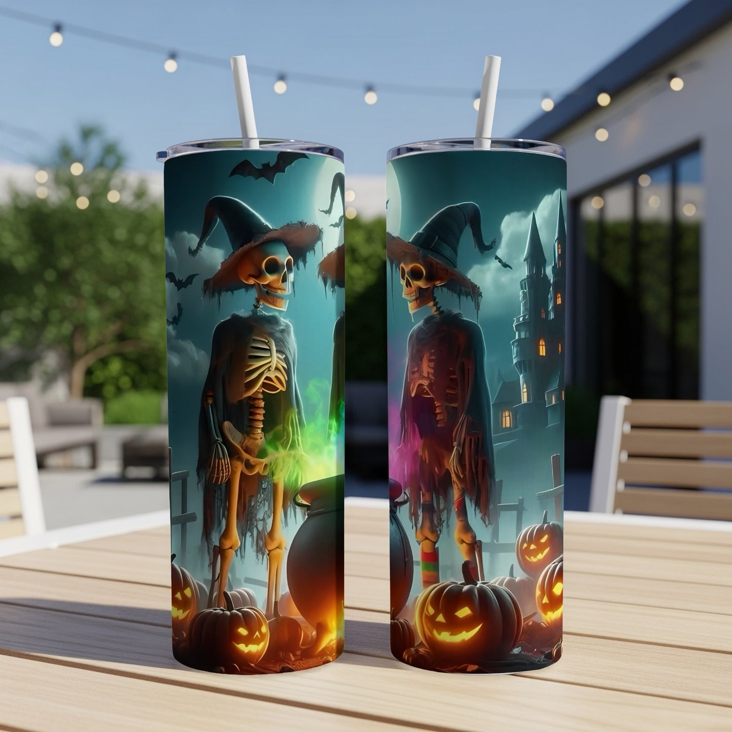 Two Halloween tumblers with skeletons, jack-o'-lanterns, and a castle under a moonlit sky.