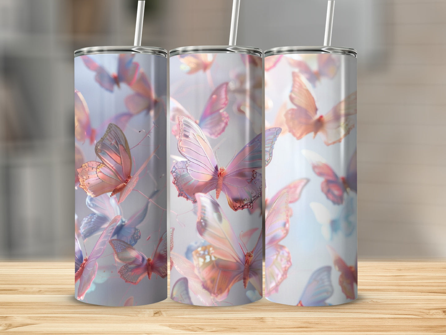 Three tumblers with iridescent butterflies and pastel watercolor splashes.