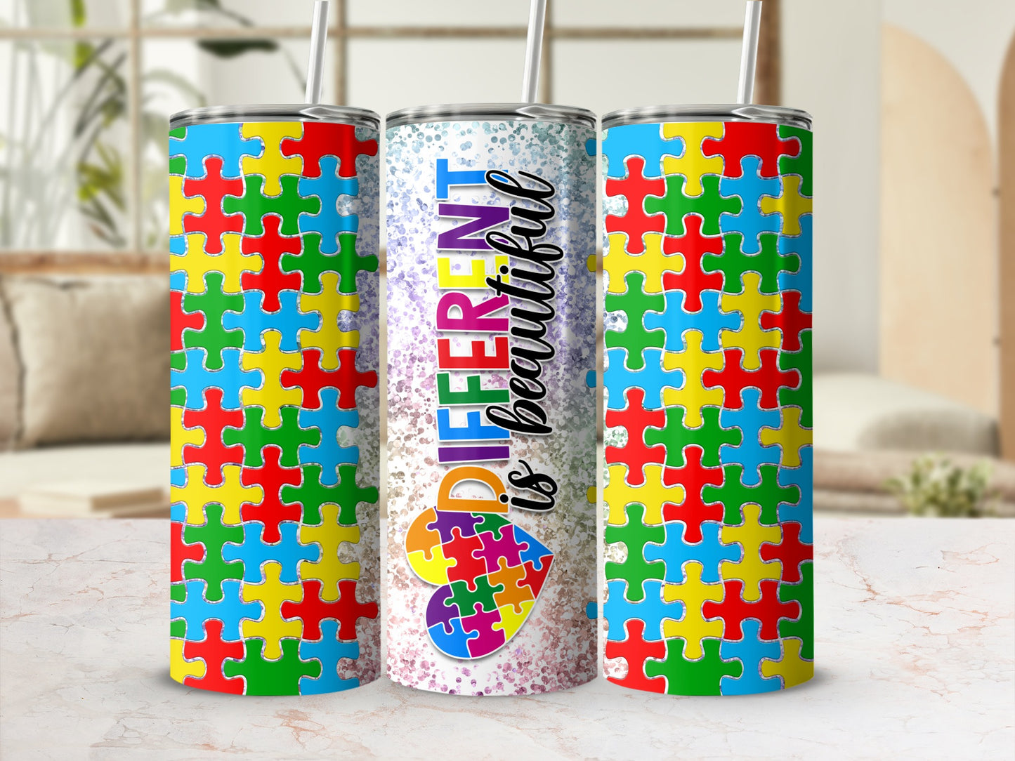 Tumbler with colorful puzzle pieces and text "DIFFERENT is BEAUTIFUL".