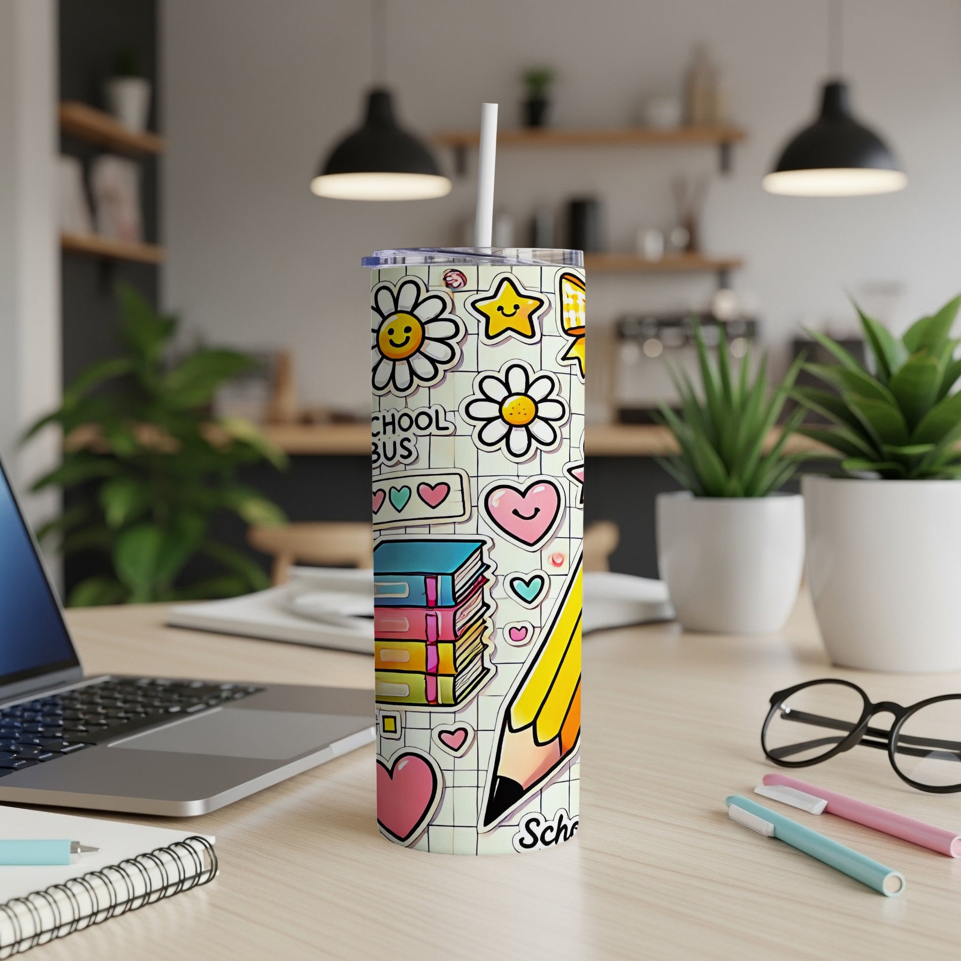 Tumbler with cartoon school supplies, flowers, and hearts, including a large pencil.
