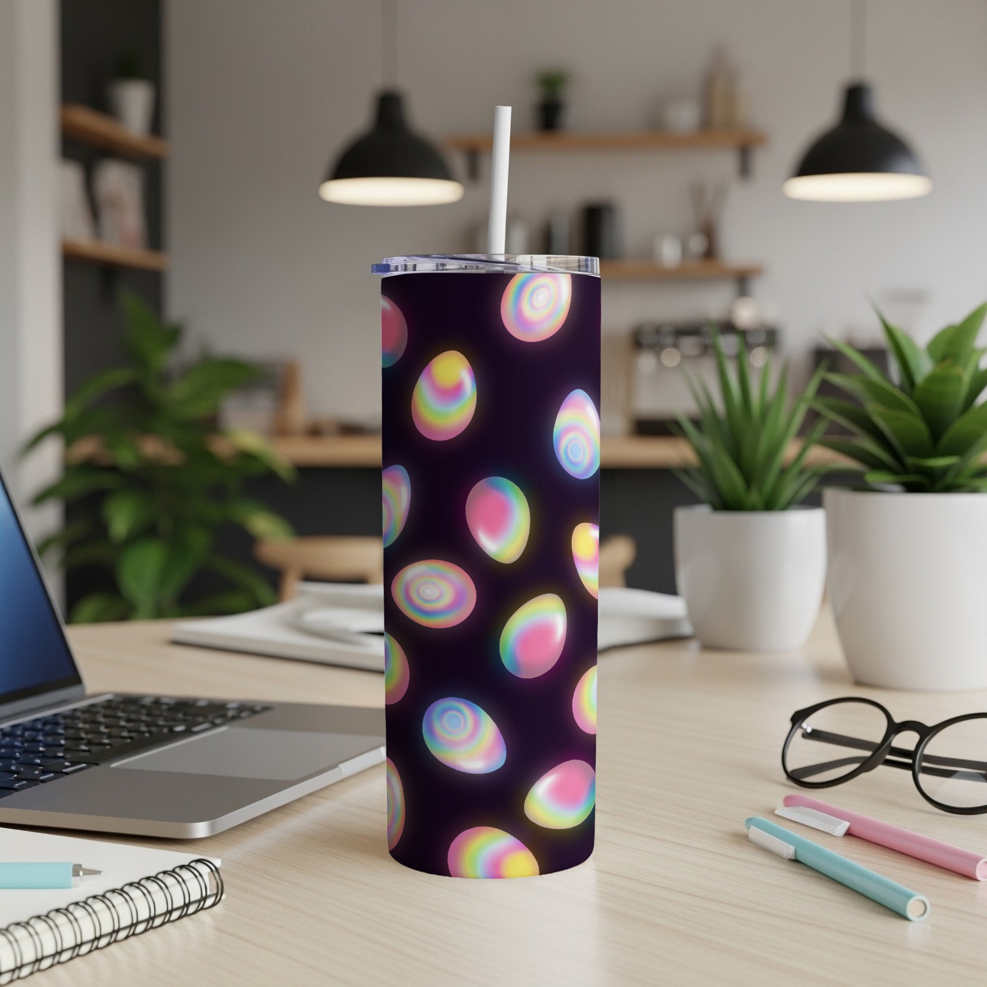 Tumbler with colorful, glowing Easter eggs on a dark background.