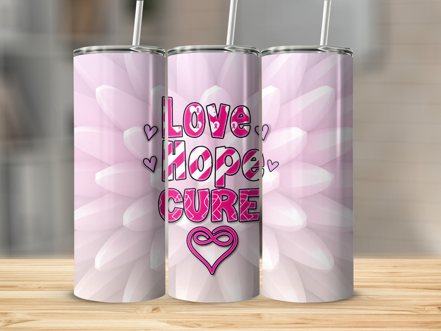 Pink floral tumbler with "Love Hope Cure" text and heart ribbon.
