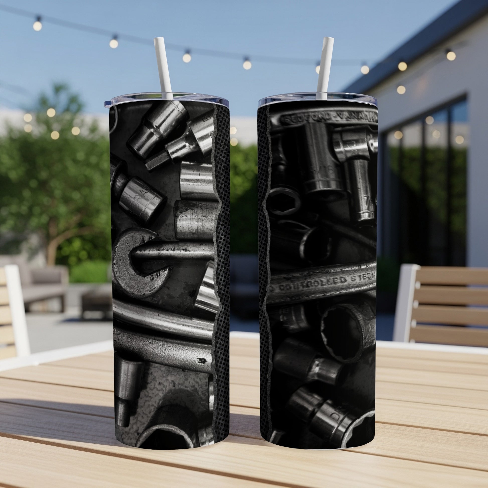 Two tumblers with a black and white wrench and socket pattern, one to the left and one to the right.