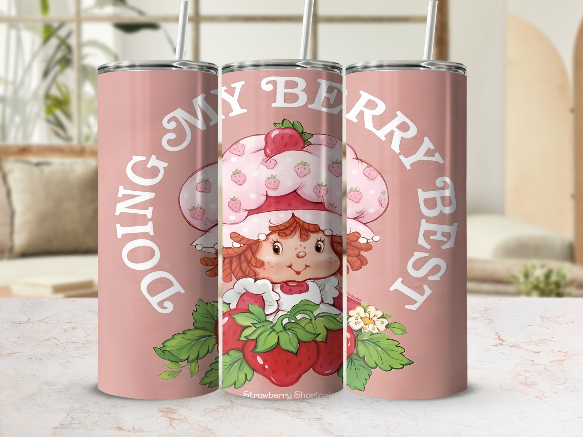Strawberry Shortcake character on pink tumbler with "Doing My Berry Best" text.