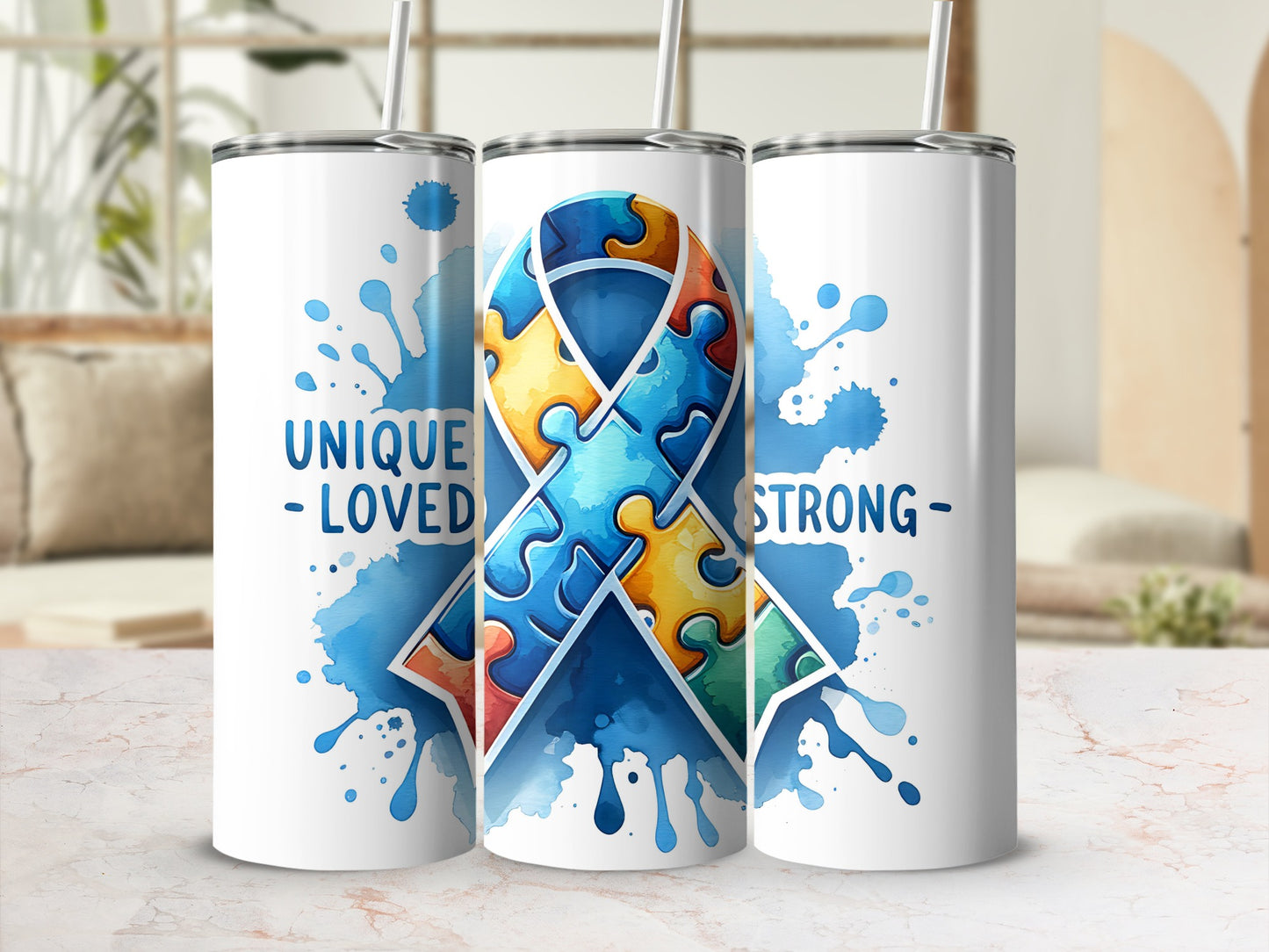 White tumblers with blue watercolor splashes and a puzzle ribbon design.