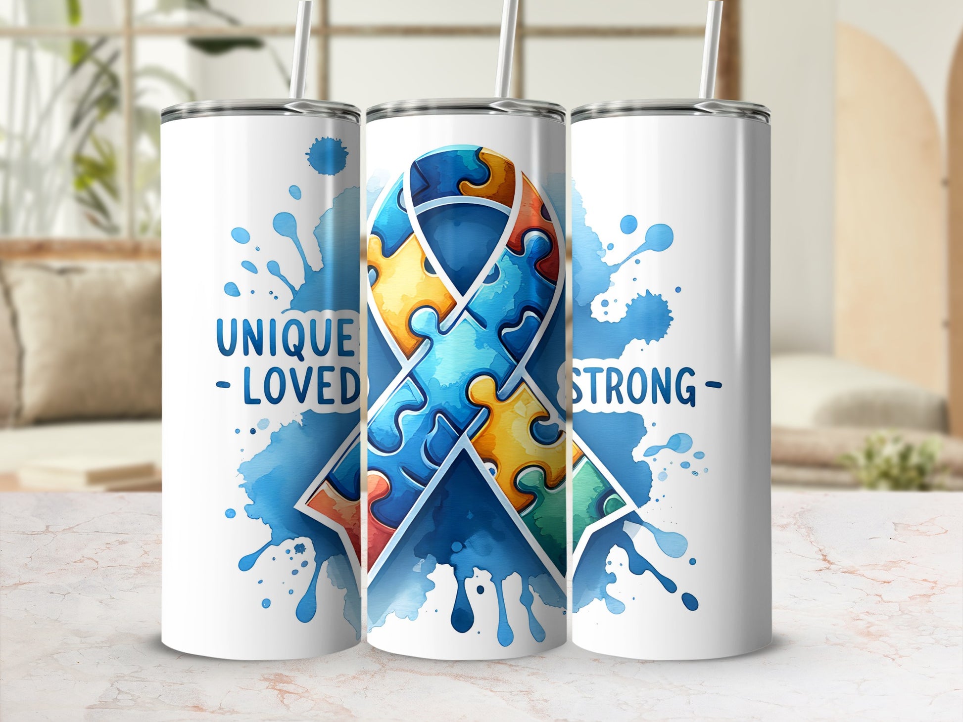 White tumblers with blue watercolor splashes and a puzzle ribbon design.
