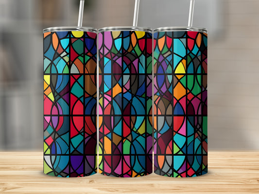 Three stained glass tumblers with colorful geometric patterns and straws.