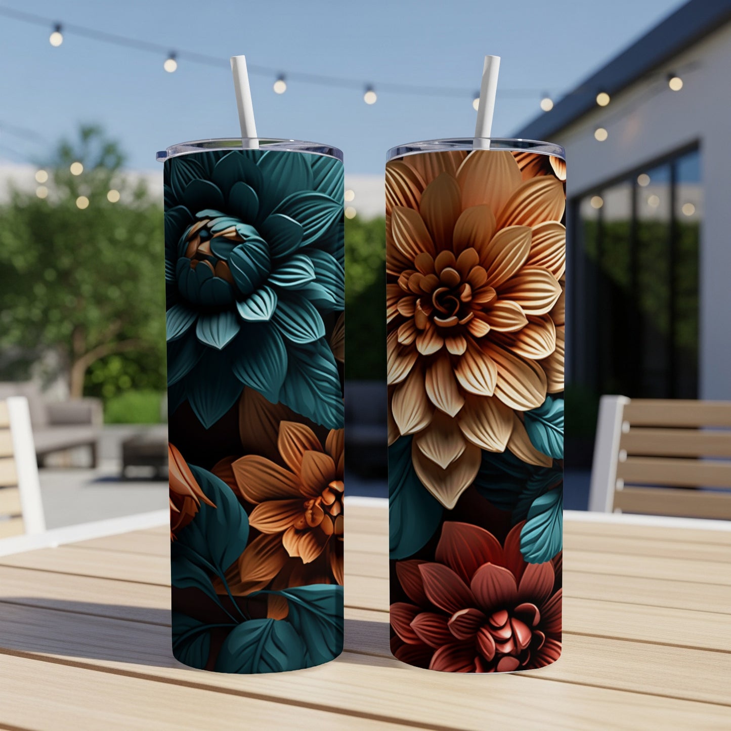 Two tall tumblers with floral designs sit on a table.