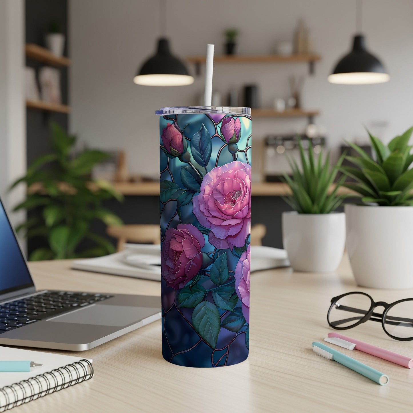 Pink roses with a mosaic overlay adorn a white tumbler with a straw.