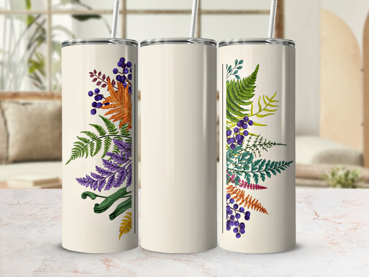 Cream tumbler with colorful floral and fern botanical design.