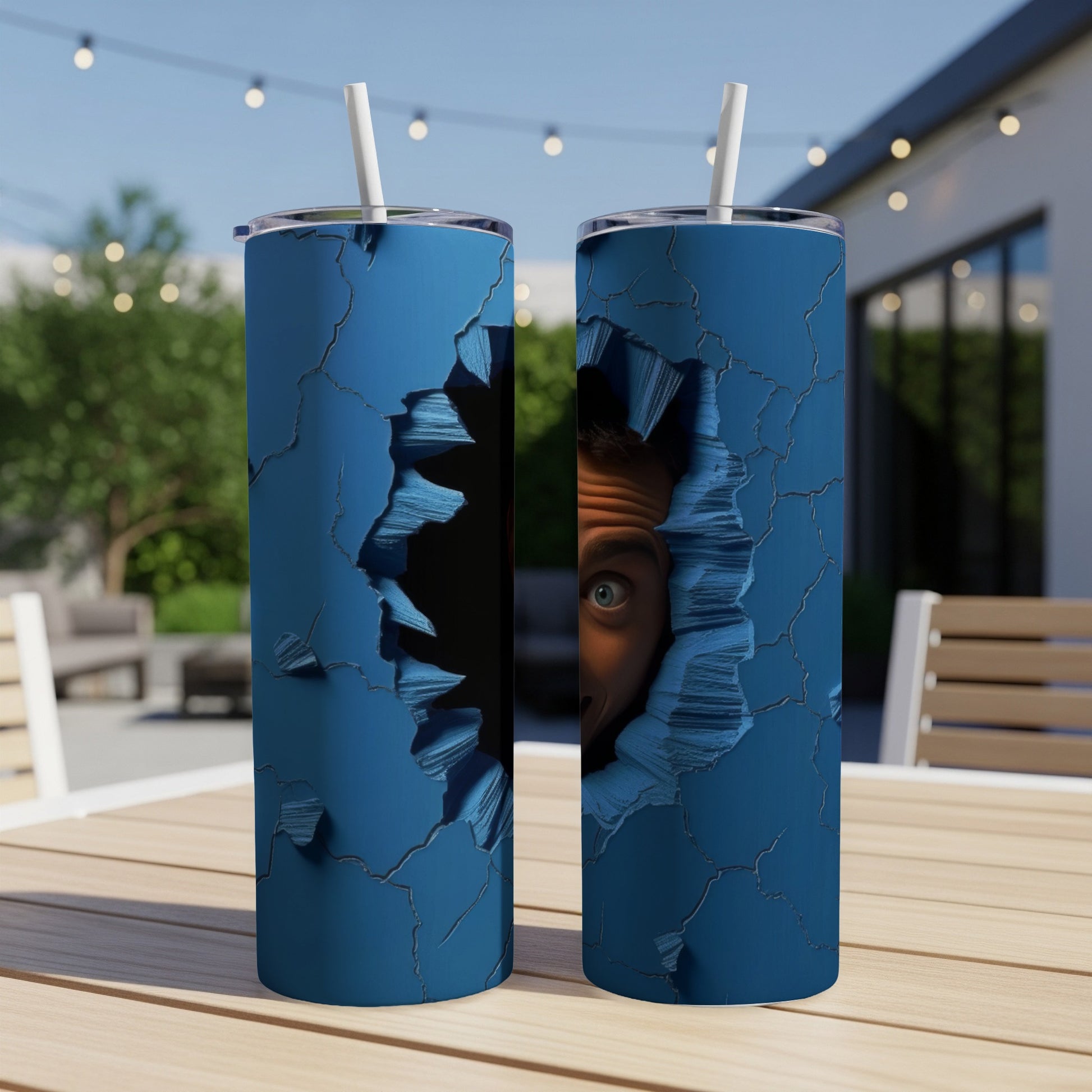 Two blue tumblers with a cracked design and a peeking eye graphic.