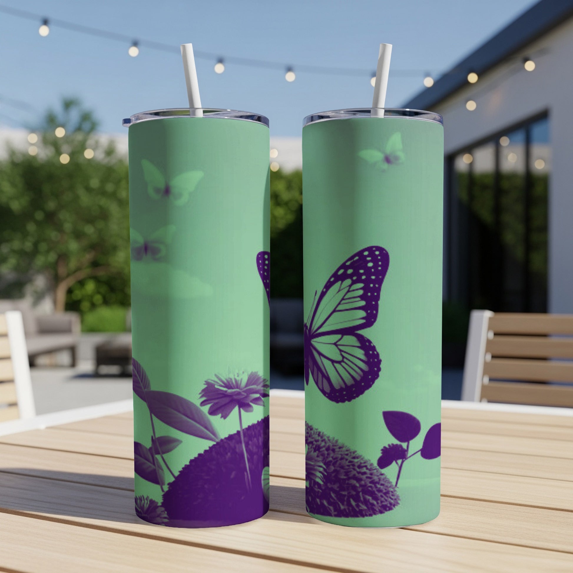 Green tumbler with purple butterfly and floral design.
