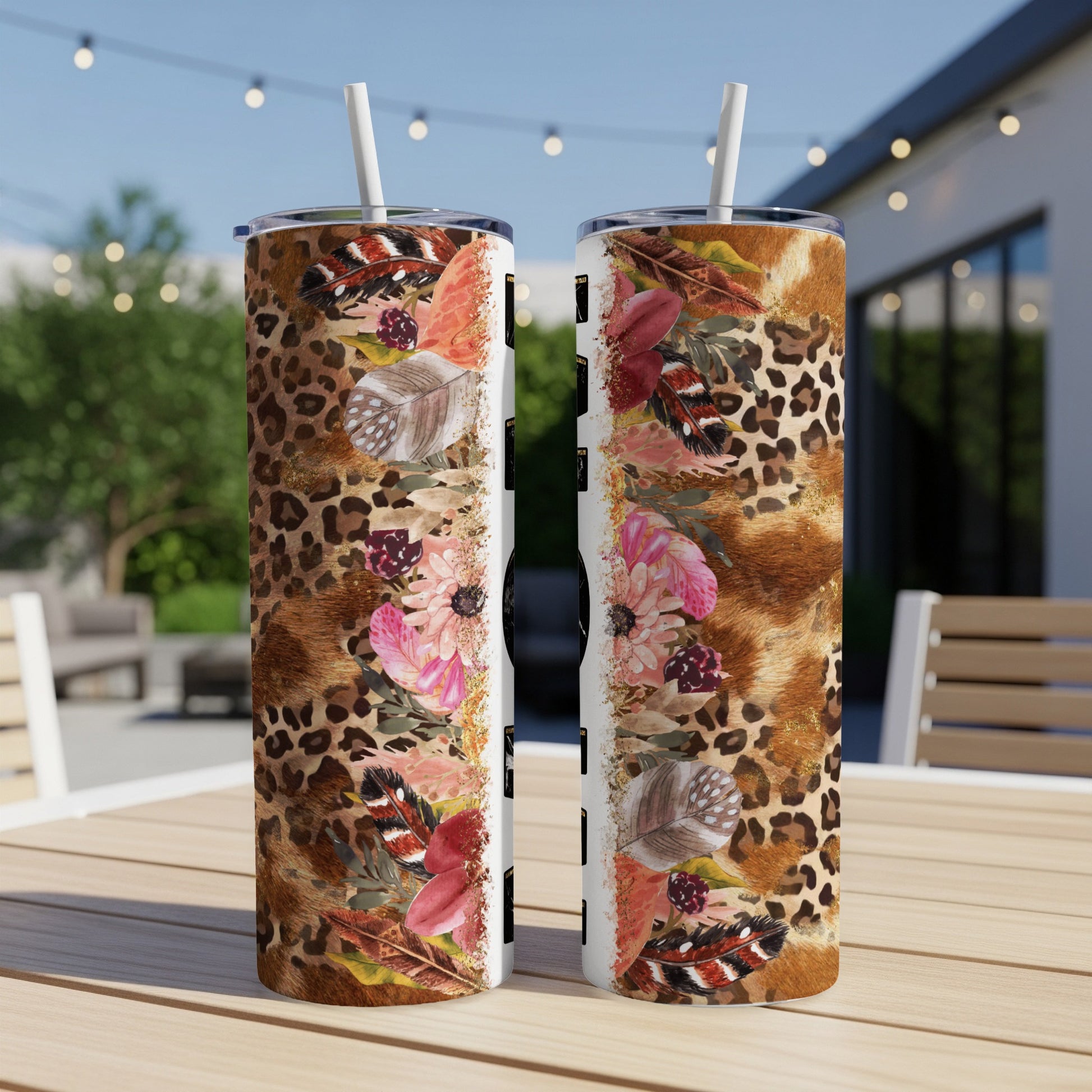 Two tumblers with leopard print, feathers, and floral designs.