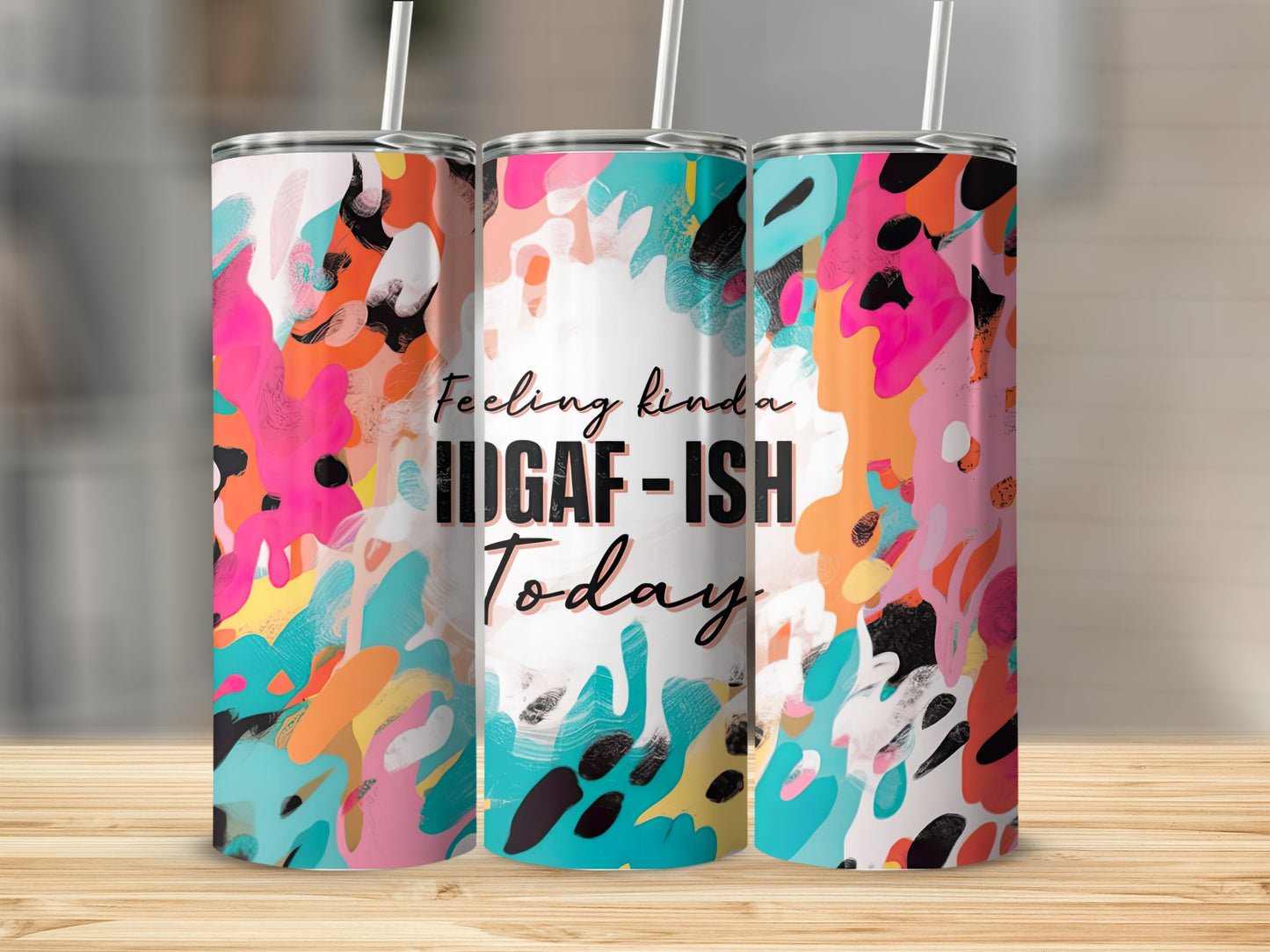 Tumbler with abstract colorful paint splatters and "Feeling kinda HIGAF-ish Today" text.