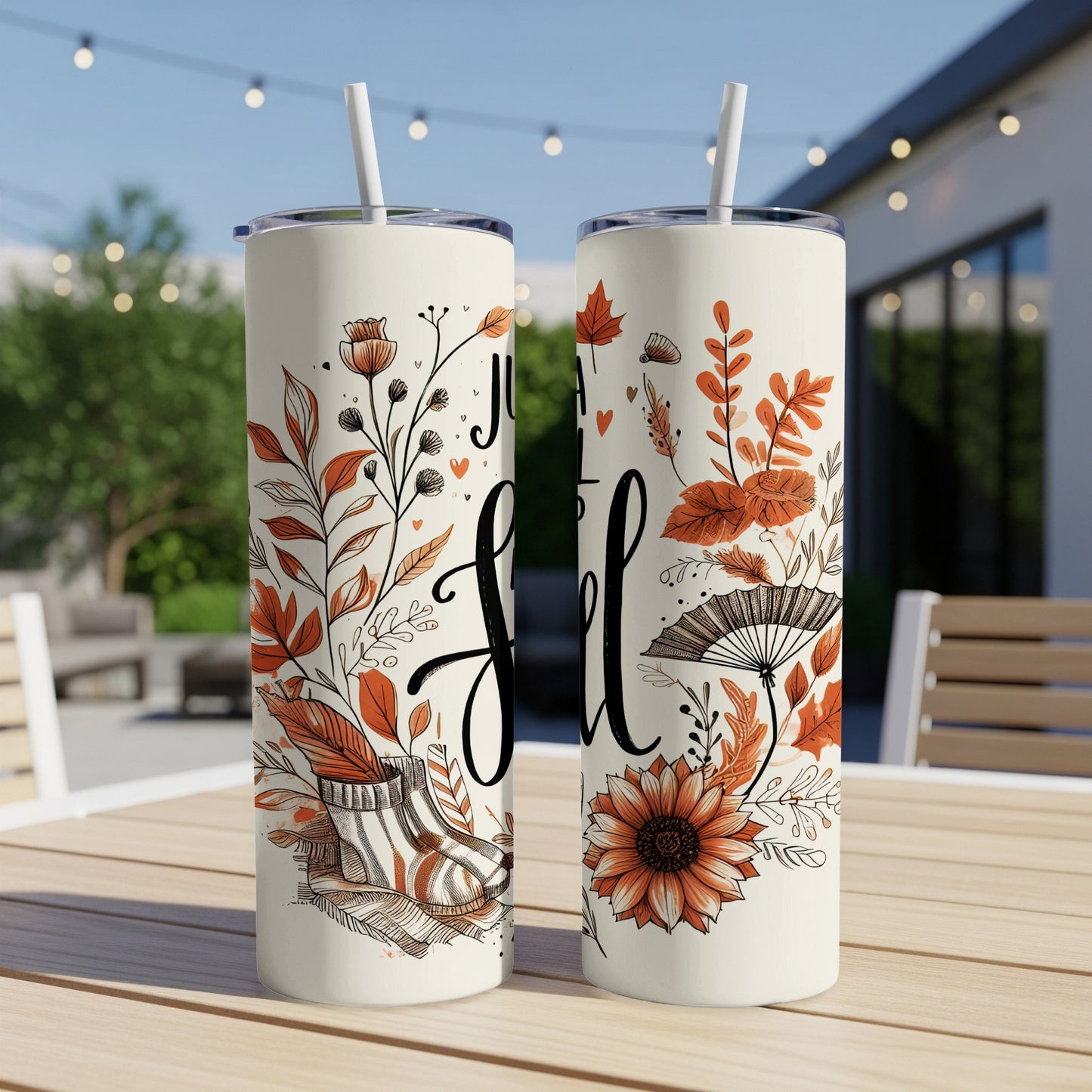Two tall tumblers with "Just a girl who loves fall" text and autumnal floral designs.