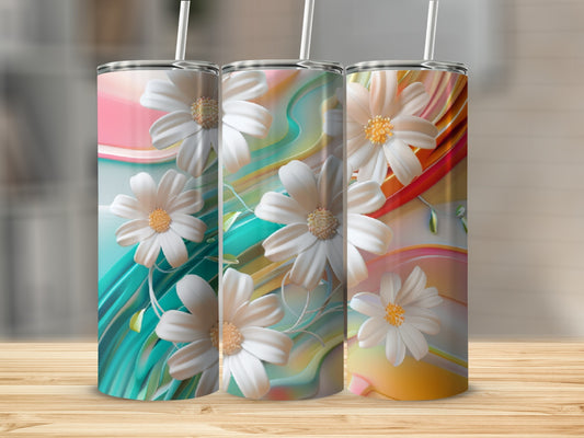 Three tumblers with white floral designs on colorful abstract backgrounds.