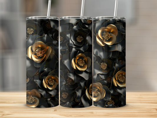Three black tumblers with gold floral accents and straws.