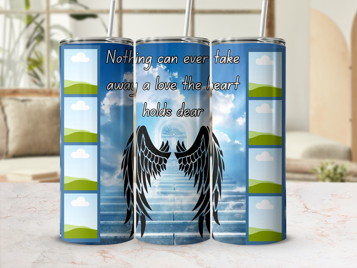 Tumbler with celestial design, angel wings, and text "Nothing can ever take away a love the heart holds dear".